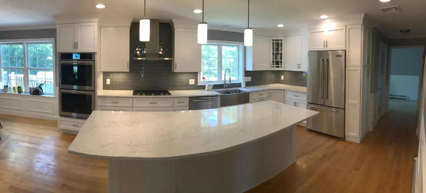 A beautiful kitchen with a spacious flow and comfortable island focal point - Image 2